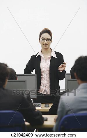 Stock Photo - Businesswoman giving a presentation. Fotosearch
