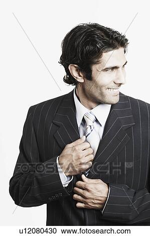 Stock Image - Close-up of a businessman smiling. Fotosearch