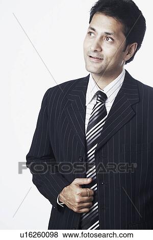 Stock Photo - Close-up of a businessman thinking. Fotosearch