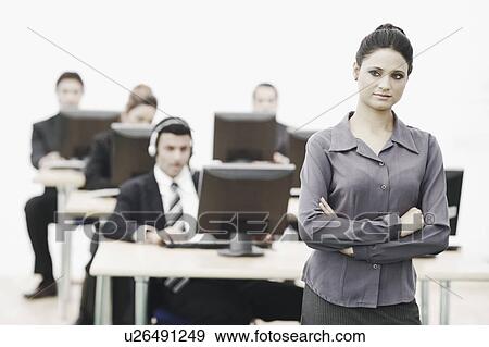Close-up of a businesswoman standing in an office View Large Photo Image Stock Photo - Close-up of a businesswoman standing in an office. Fotosearch