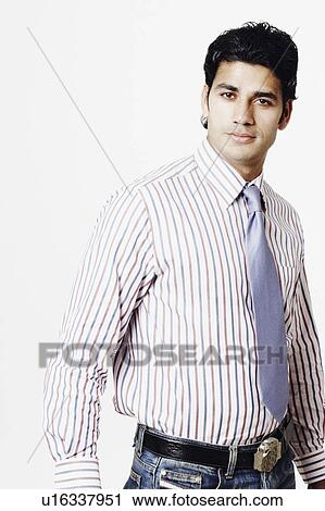 Stock Image - Portrait of a businessman looking serious. Fotosearch