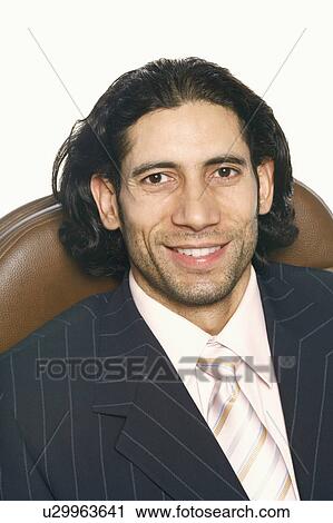 Portrait of a businessman smiling View Large Photo Image Stock Image - Portrait of a businessman smiling. Fotosearch