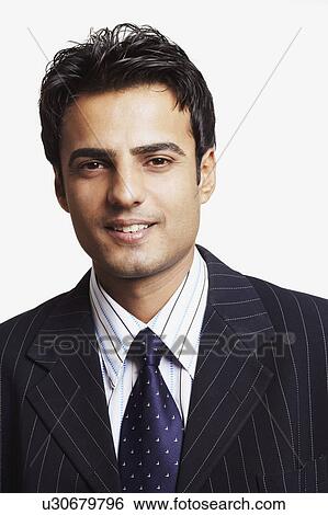 Stock Photograph - Portrait of a businessman smiling. Fotosearch