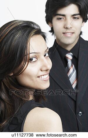 Portrait of a businesswoman looking over her shoulder View Large Photo Image Stock Photo - Portrait of a businesswoman looking over her shoulder. Fotosearch