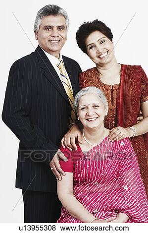 Stock Photo - Portrait of a mature woman with her son and daughter smiling. Fotosearch