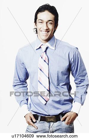 Stock Photo - Portrait of a young man with his hands in his pockets. Fotosearch