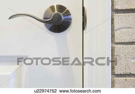 Stock Image - Detail of door knob (close up). Fotosearch
