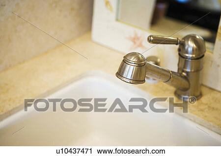 Stock Image - Detail of kitchen faucet. Fotosearch