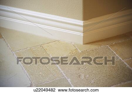 Stock Image - Detail of Wall and Tile Floor in Home. Fotosearch