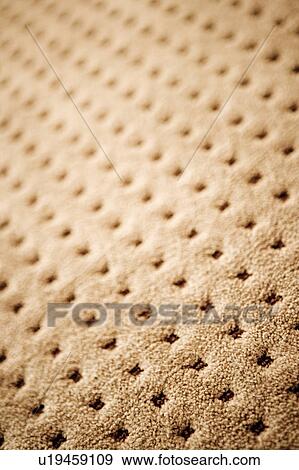 Stock Photo - Detail Shot of Textured Beige Carpet with Square Pattern. Fotosearch