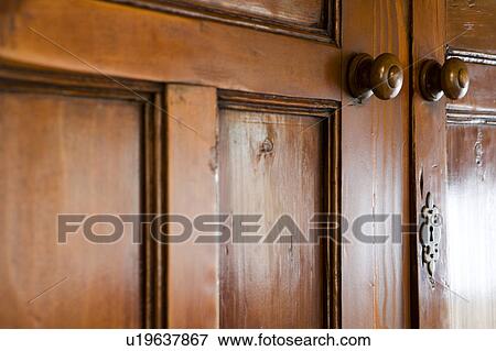 Vintage/Antique Wood Cupboards with Wood Knobs and Metal Keyhol View Large Photo Image Stock Photo - Vintage/Antique Wood Cupboards with Wood Knobs and Metal Keyhol. Fotosearch