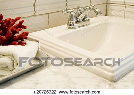Stock Image - Bathroom Sink with Red Coral. Fotosearch