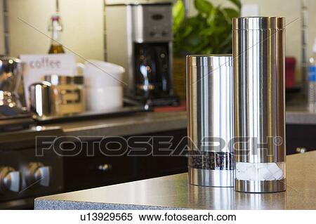 Stock Photography - Decorative Chrome Cannisters in Kitchen. Fotosearch