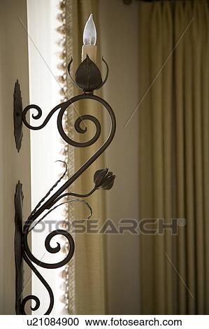 Decorative wrought iron with light View Large Photo Image Stock Image - Decorative wrought iron with light. Fotosearch