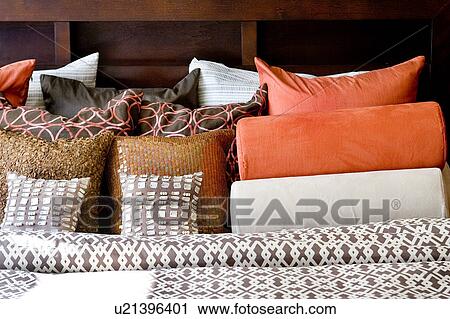 Stock Image - Detail of Colorful Patterned Bed Sheets and Pillows. Fotosearch