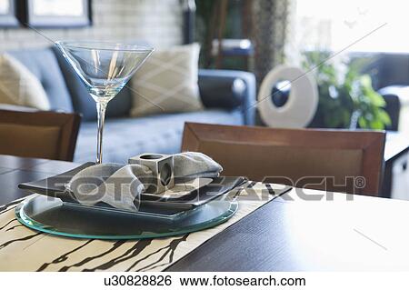 Detail of place setting with plates, napkins and martini glass View Large Photo Image Stock Photograph - Detail of place setting with plates, napkins and martini glass. Fotosearch