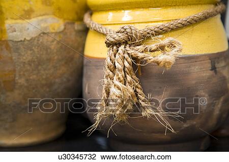 Detail of yellow pot with rope. View Large Photo Image Stock Image - Detail of yellow pot with rope.. Fotosearch