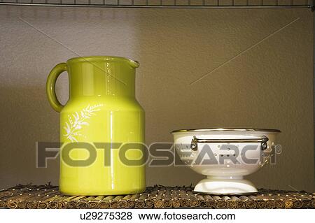 Green Pitcher and White Strainer on Shelf View Large Photo Image Stock Photo - Green Pitcher and White Strainer on Shelf. Fotosearch