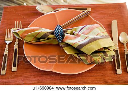 Picture - Orange Table Setting. Fotosearch