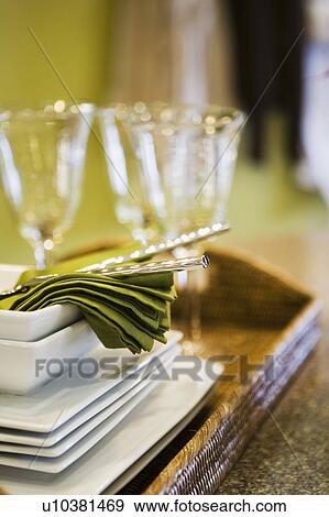 Stock Photo - Tray with Crystal Glasses, White Dishes, and Green Napkins. Fotosearch