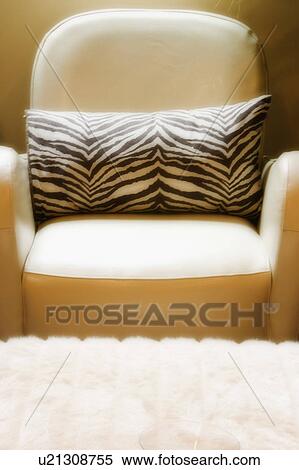 Stock Photography - White Leather Chair with Zebra Print Pillow. Fotosearch