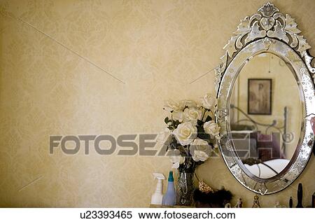 Stock Photography - White roses next to antique vanity mirror. Fotosearch