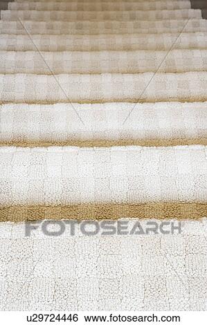 Stock Photograph - Carpeted staicase, high angle, close up. Fotosearch