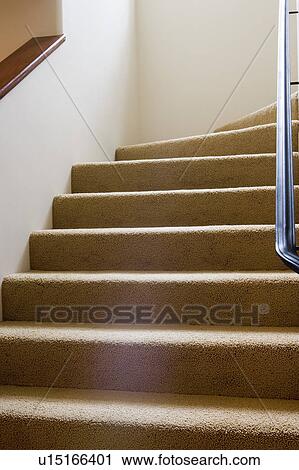 Stock Image - Detail of carpeted steps leading upward.. Fotosearch