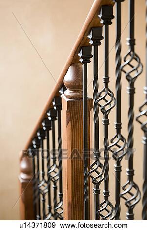 Stock Photo - Detail of descending staircase banister. Fotosearch