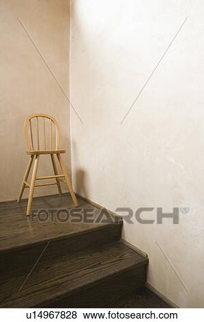 Detail of high chair on a hardwood staircase View Large Photo Image Stock Photo - Detail of high chair on a hardwood staircase. Fotosearch