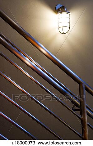 Detail of industrial staircase railing and light View Large Photo Image Stock Image - Detail of industrial staircase railing and light. Fotosearch