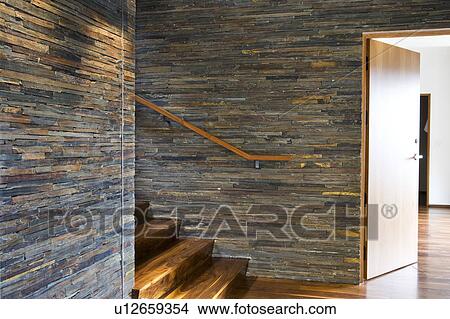 Picture - Hardwood Starcase with Stone Tile Walls. Fotosearch
