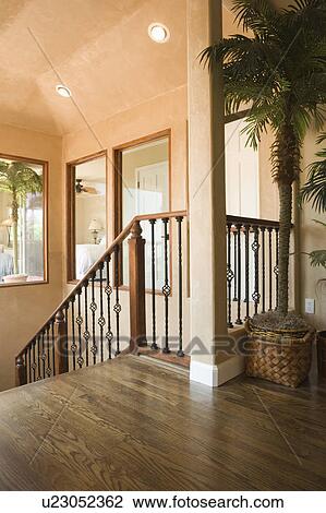 Stock Image - Interior view of descending staircase. Fotosearch