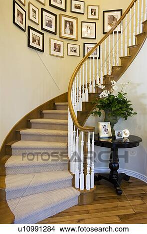 Vignette of curved staircase and pictures. View Large Photo Image Picture - Vignette of curved staircase and pictures.. Fotosearch