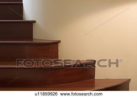 Wooden steps against light wall View Large Photo Image Stock Photograph - Wooden steps against light wall. Fotosearch