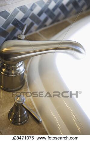 Stock Photography - Contemporary Faucet and Backsplash. Fotosearch