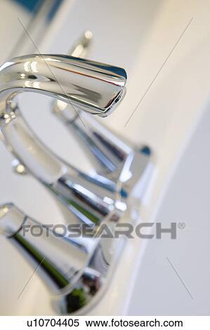 Stock Photography - Detail of chrome faucet, close up. Fotosearch