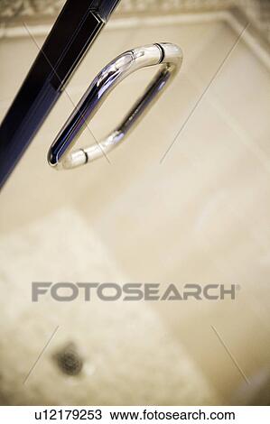 Detail of chrome shower handle on glass door. View Large Photo Image Stock Image - Detail of chrome shower handle on glass door.. Fotosearch