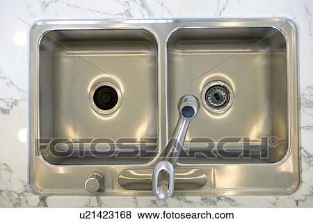 Stock Photo - Stainless steel kitchen sink. Fotosearch