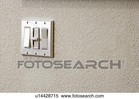 Stock Photography - Three Switch Light Panel on Wall. Fotosearch