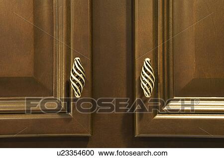 Wood Cabinets with Ornate Handles View Large Photo Image Stock Image - Wood Cabinets with Ornate Handles. Fotosearch