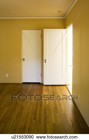 Stock Image - Door Open in Empty Yellow Room. Fotosearch
