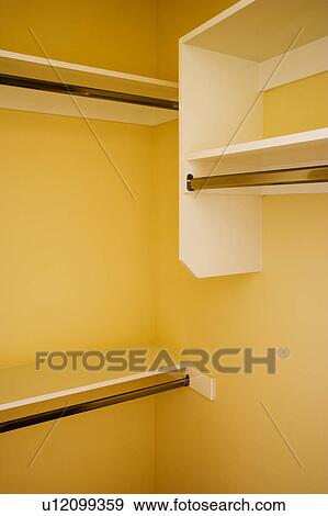 Inside of Empty Yellow Closet with Built In Shelves View Large Photo Image Stock Photo - Inside of Empty Yellow Closet with Built In Shelves. Fotosearch