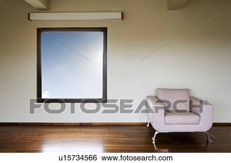 Stock Photograph - Modern Leather Archair Under Window. Fotosearch