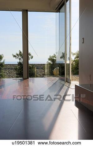 Stock Image - Modern Living Room with Hardwood Floors. Fotosearch