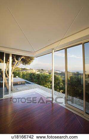 Stock Image - Modern Living Room with Sliding Door. Fotosearch