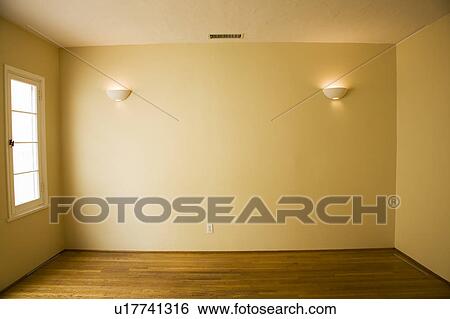 Stock Photograph - Sconce on Wall in Yellow Room. Fotosearch