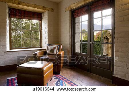 Picture - Spanish Style Room and Brown Leather Chair. Fotosearch