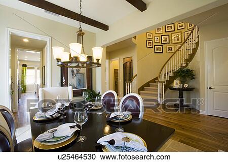 Dining room with staircase in background View Large Photo Image Stock Image - Dining room with staircase in background. Fotosearch