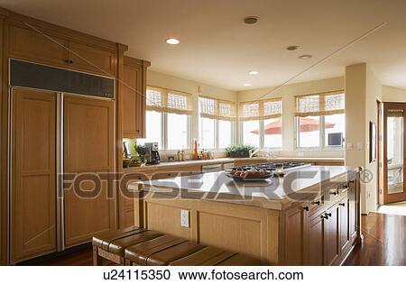 Stock Image - Image of contemporary kitchen with island. Fotosearch